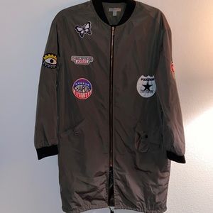 Long green patch windbreaker